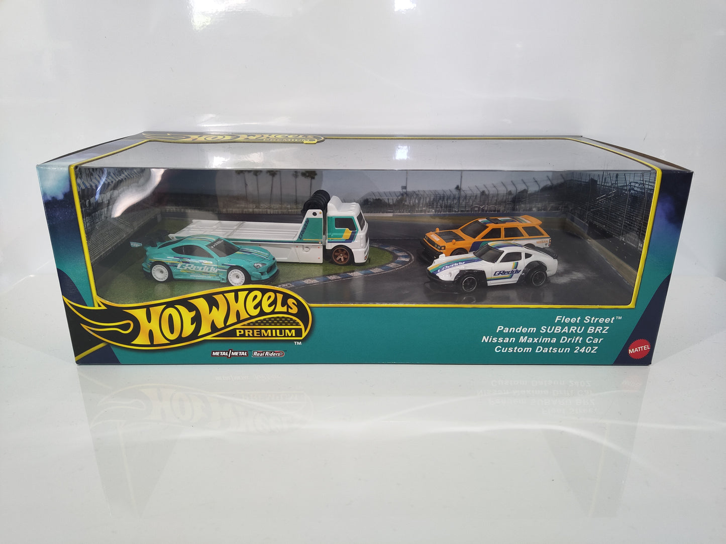 Hot Wheels Premium Diorama Subaru, Nissan, Datsun and Fleet Street Truck.